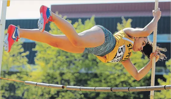  ?? LIFFORD SKARSTEDT EXAMINER ?? St. Peter's Kassandra Yonemitsu clears the bar in the pole vault event during the Kawartha Track and Field event on Thursday at the Thomas A. Stewart Secondary School athletic field.