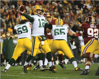  ?? File photos ?? Aaron Rodgers (above), Tom Brady (below), Philip Rivers and Drew Brees combined to throw for 1,426 yards and 12 touchdowns in the opening week of the season. Only Brady’s Patriots and Rodgers’ Packers won.