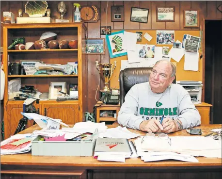  ?? [NATE BILLINGS/ THE OKLAHOMAN] ?? Seminole High School football coach Mike Snyder — who won his 364th game last Friday, the most in Oklahoma history — sits in his office at Chieftain Stadium on Wednesday.