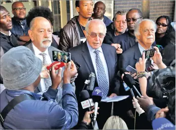  ?? PICTURE: EPA ?? Former judge, Johan Kriegler, centre, and lawyer George Bizos, right, address the media at the head offices of the Hawks police unit after South African Finance Minister, Pravin Gordhan, failed to appear before the South African Police Service offices...
