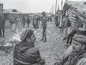  ?? MAURICIO LIMA/NEW YORK TIMES ?? Migrants at a camp called ‘the Jungle’ in Calais, France, last month. The number of migrants setting off into the English Channel by boat has soared in recent months.