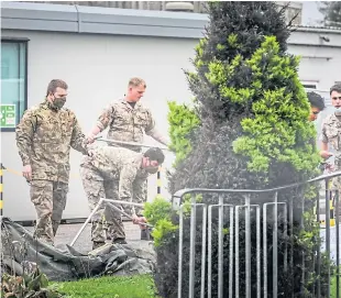  ?? Picture: Mhairi Edwards. ?? Soldiers erecting a tent for Covid-19 testing.