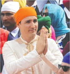  ?? NARINDER NANU / AFP / GETTY IMAGES FILES ?? Prime Minister Justin Trudeau pays his respects at the Golden Temple in Amritsar while on a visit to India in February 2018.