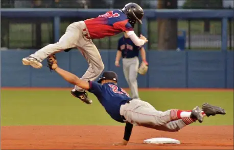  ?? KYLE FRANKO/ TRENTONIAN PHOTO ?? Broad St. Park Andy Jaquez, right, tags out Brooklawn’s Chase Conklin, left, at second base during the NJ American Legion state final at Kean University on Wednesday.