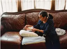  ?? Eric Gay/associated Press ?? Olivia Godden feeds her infant son at their home in San Antonio. She, like others in the U.S., has struggled to find baby formula.