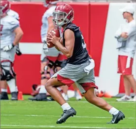  ??  ?? Alabama quarterbac­k Taulia Tagovailoa works through drills in Alabama’s fall camp fan-day college football scrimmage, Saturday, at Bryant-Denny Stadium in Tuscaloosa, Ala.