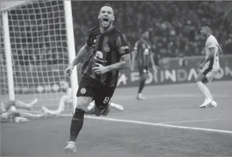  ?? AP ?? Marko Arnautovic celebrates scoring for Inter Milan to earn a 1-0 victory over Atletico Madrid in the first leg of their Champions League last16 tie at the San Siro Stadium in Milan on Tuesday. The second leg takes place in Madrid on March 13.