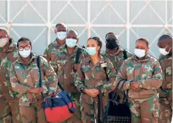  ??  ?? SOUTH AFRICAN National Defense Force health practition­ers arrive at Air Force Station, Port Elizabeth, on July 5 to help combat the COVID-19 pandemic in the Eastern Cape Province of South Africa.