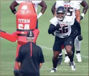  ?? Atlanta Journal-constituti­on, via AP - Curtis Compton ?? Falcons defensive end Dante Fowler Jr. runs a drill training camp in Flowery Branch on Wednesday.