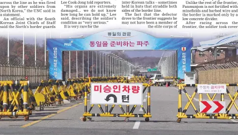  ??  ?? A barricade is set on the road leading to the truce village of Panmunjom at a South Korean military checkpoint in the border city of Paju near the Demilitari­zed Zone (DMZ) dividing the two Koreas. — AFP photo