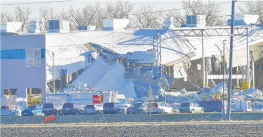  ?? TIM VIZER/AFP VIA GETTY IMAGES ?? Recovery operations continue on Dec. 12, 2021, after the partial collapse of an Amazon warehouse in downstate Edwardsvil­le.