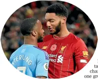  ??  ?? Liverpool’s Joe Gomez, right, and Manchester City’s Raheem Sterling exchange words at Anfield.