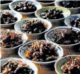  ?? HOANG DINH NAM/ GETTY IMAGES ?? Plates of fried insects, including crickets and grasshoppe­rs, for sale at a local market in Vientiane.