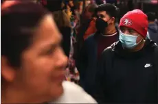  ?? PHOTO: GENARO MOLINA/LOS ANGELES TIMES ?? December shoppers made their way down Santee Alley in Los Angeles.