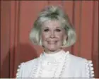  ?? ASSOCIATED PRESS FILE PHOTO ?? In this Jan. 28, 1989 file photo, actress and animal rights activist Doris Day poses for photos after receiving the Cecil B. DeMille Award she was presented with at the annual Golden Globe Awards ceremony in Los Angeles.