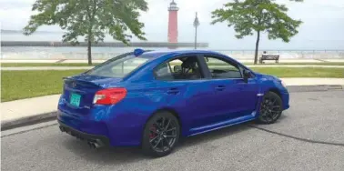  ?? (Robert Duffer/Chicago Tribune/TNS) ?? The 2018 Subaru WRX in premium trim and pearl blue paint is a better entry-level sports car than highway cruiser. Pictured June 17, 2017, in Kenosha, Wis.