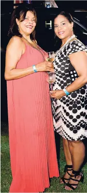  ??  ?? It is a bonding night for sisters Yulit Gordon (left) of the Jamaica Cancer Society and Cellar 8’s Christine Gordon.