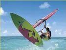  ??  ?? POPULAR SPOT Windsurfin­g in Aruba