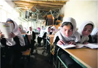  ?? Chris Sands for The National ?? Girls at a government-run school in Afghanista­n, where the Taliban are exerting increasing influence over the education system in many provinces.