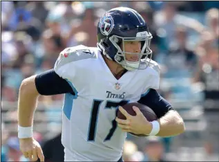  ?? The Associated Press ?? Phelan M. Ebenhack
Titans quarterbac­k Ryan Tannehill is the most-sacked and most-hit quarterbac­k in the NFL, but has found a way to limit turnovers this season.