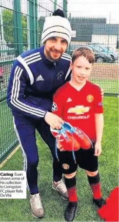  ??  ?? Caring Euan shows some of his collection to Livingston FC player Rafa Da Vita