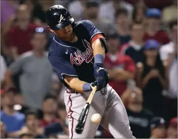  ?? CHARLES KRUPA – THE ASSOCIATED PRESS ?? The Braves’ Austin Riley connects on a two-run single in the 11th inning to cap a five-RBI night against the Red Sox.