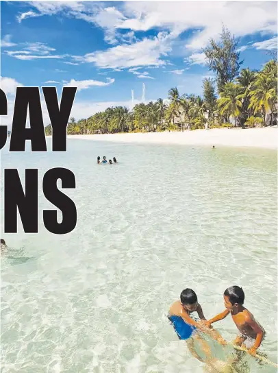  ?? Of Paulo Alcazaren) (Photo courtesy ?? YOUNG boys enjoy the pristine waters of Boracay ahead of its reopening on Oct. 26.