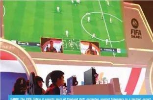  ?? —AFP ?? HANOI: The FIFA Online 4 esports team of Thailand (left) competes against Singapore in a football esport game during the 31st Southeast Asian Games (SEA Games) in Hanoi on May 14, 2022.