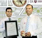  ??  ?? From left: Emil Ranasinghe­ge – Assistant Manager Finance and Roschen Perera - Chief Financial Officer of Overseas Realty (Ceylon) PLC with the award