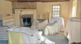  ??  ?? Sheets cover furniture in the master bedroom of the Pearl S. Buck House while restoratio­n is under way.