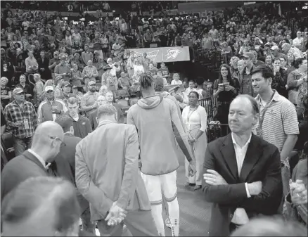  ?? Bryan Terry Associated Press ?? OKLAHOMA CITY THUNDER players exit the court after the game with the Utah Jazz is called off over coronaviru­s concerns.