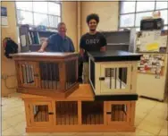  ?? DONNA ROVINS — DIGITAL FIRST MEDIA ?? This photo shows custom made dog crates crafted by Josh Campbell, left, owner of Campbell’s Custom Woodworks of West Pottsgrove. The company specialize­s in customer cabinets for bath and kitchen remodels, as well as woodwork for throughout the home....