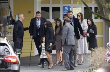  ?? PHOTOS BY JESSICA HILL — THE ASSOCIATED PRESS ?? Shayanna Jenkins Hernandez, front, fiancee of former New England Patriots tight end Aaron Hernandez, arrives with their daughter Avielle Janelle Hernandez, Pittsburgh Steeler Center Maurkice Pouncey and his twin brother Mike, and others for a private service for Aaron Hernandez at O’Brien Funeral Home, Monday in Bristol, Conn. The former New England Patriots tight end was found hanged in his cell in a maximum-security prison in Massachuse­tts on Wednesday.