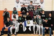  ?? Contribute­d ?? The New Milford wrestling team won the Gary Tiger Ridgefield Challenge on Saturday.