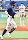  ?? Julio Aguilar / Getty Images ?? The Rays’ Brandon Lowe rounds the bases on his home run off of Red Sox starter Nick Pivetta in the first inning on Monday.