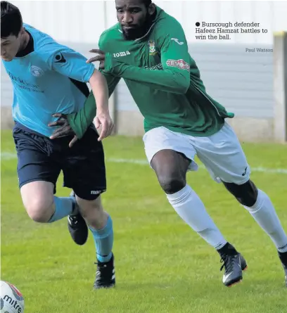  ?? Burscough defender Hafeez Hamzat battles to win the ball. Paul Watson ??