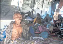  ?? FAUZY CHANIAGO — THE ASSOCIATED PRESS ?? An elderly man rests in a makeshift hospital after surviving a major earthquake in Kayangan on Lombok Island, Indonesia, on Monday.