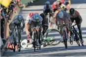  ?? CHRISTOPHE ENA/THE ASSOCIATED PRESS ?? Britain’s Mark Cavendish crashes Tuesday during the sprint of the fourth stage of the Tour de France with start in Mondorf-les-Bains, Luxembourg, and finish in Vittel, France.
