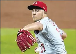  ?? Gene J. Puskar Associated Press ?? THE DEFENDING CHAMPION Dodgers added standout pitcher Trevor Bauer on a three-year contract this month, a luxury few teams could have afforded.