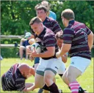  ?? DEBBY HIGH/FOR DIGITAL FIRST MEDIA ?? North Penn’s Scrum Rags’ Tim Mascianton­io kept the ball safe with teammates against Harrisburg during Saturday’s North Penn Rugby Club’s Annual 7’s Tournament.