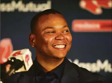  ?? Nancy Lane / Nancy Lane ?? Red Sox third baseman Rafael Devers has plenty of reasons to smile after signing a 10-year, $313.5 million contract extension with the team.