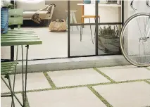  ??  ?? Imola Ceramica’s beige porcelain tiles form an outdoor patio floor.