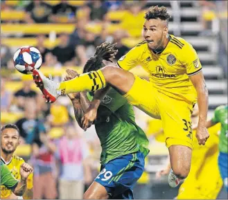  ?? [FRED SQUILLANTE/DISPATCH PHOTOS] ?? Crew forward JJ Wiliams is unable to kick home a corner kick against Sounders defender Roman Torres.