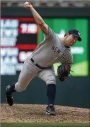  ?? BRUCE KLUCKHOHN - ASSOCIATED PRESS ?? New York Yankees relief pitcher Tommy Kahnle throws to the Minnesota Twins in the eighth inning of a baseball game Wednesday.