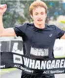  ?? Photo / Tania Whyte ?? Louis Young crosses the finish line of the Whanga¯rei half marathon in a course record time.