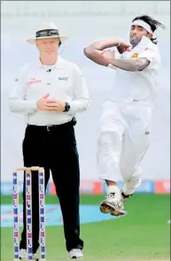  ??  ?? Nuwan Pradeep delivers a ball during the opening day of the second cricket Test match between Pakistan and Sri Lanka at the Dubai Internatio­nal Cricket Stadium - AFP