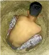  ??  ?? The protesting refugees on Manus Island have posted photos online of them digging wells in an attempt to find water, which they are storing in rubbish bins.