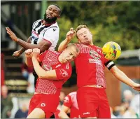  ?? ?? HEADS UP: Bromsgrove Sporting’s Leon Broadhurst and Jake Bloomer in an aerial challenge against Grimsby