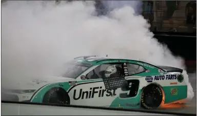  ?? (AP/Mark Humphrey) ?? Chase Elliott performs a victory burnout on the frontstret­ch at Bristol (Tenn.) Motor Speedway after winning the NASCAR All-Star Race on Wednesday night. Elliott, whose father Bill Elliott won the event in 1986, won the event for the first time.