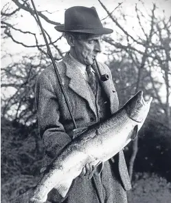  ??  ?? James McLeay with the 17lb salmon he caught after just 10 minutes on the opening day of the Tay Salmon Rod Fishing season on Loch Tay on January 17 1950.